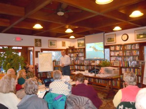 Ed Robinson, a Trustee for the Harpswell Heritage Land Trust, spoke about the Harpswell walking trail system and trust properties under development. There was a capacity crowd in the Sue Fisher Moren Memorial Reading Room. 